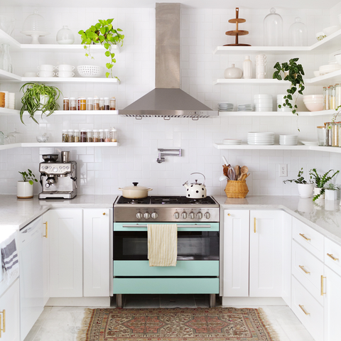 White kitchen with stainless steel appliances