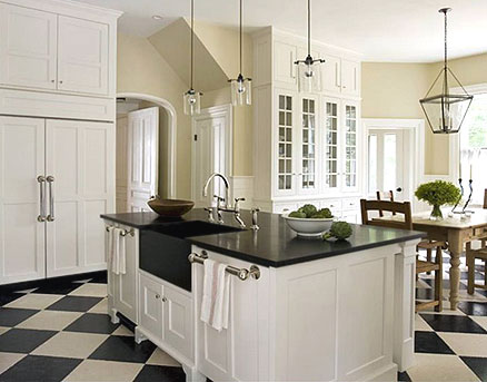 White kitchen cabinets with black granite countertops