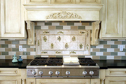 A kitchen tile design idea - the backsplash here is created of natural stone tiles in combination with multi-colored ceramic tiles