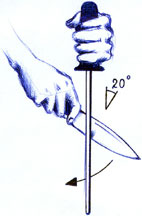 Sharpening a knife using a honing steel.